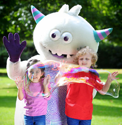 Rufus making soap bubbles with children