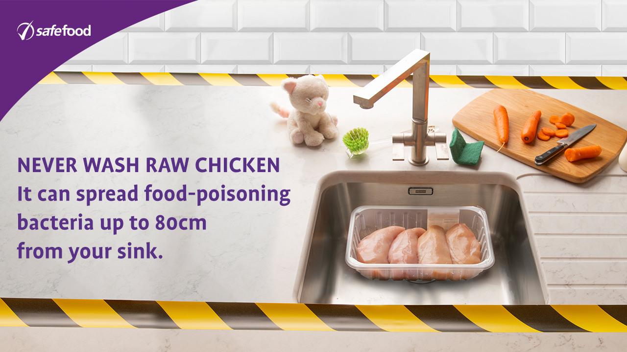Chicken in a sink near child's toy on the counter