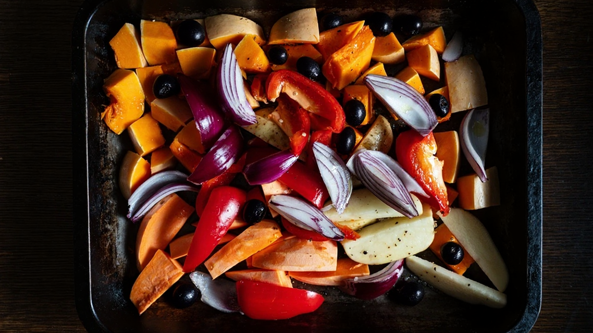 Roasted butternut squash with tomato, red pepper, olives and potato     
