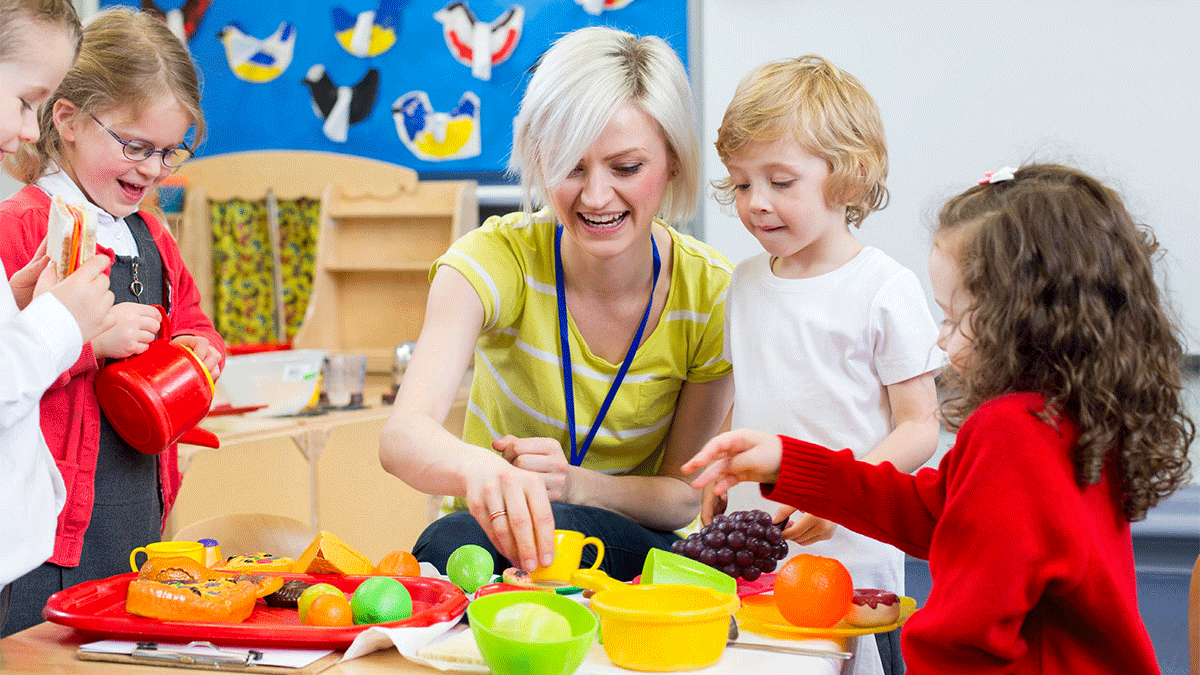 Young children with teacher learning about food