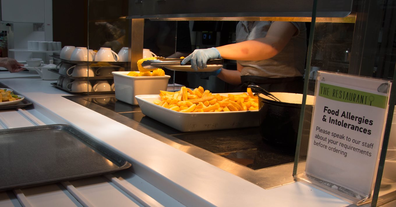 Food being served at buffet. Keep your customers safe.