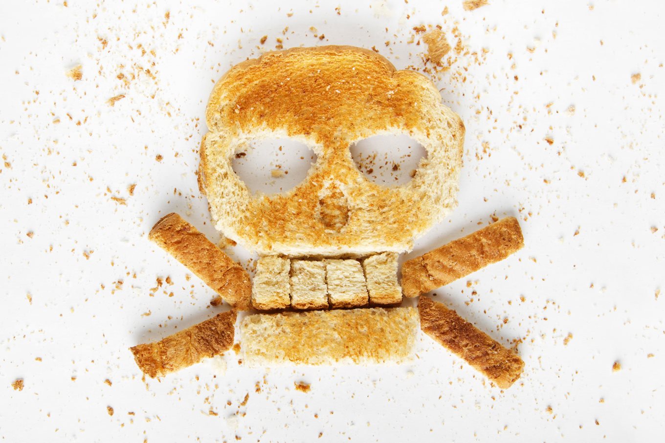 Slice of toast cut into the shape of a poison symbol