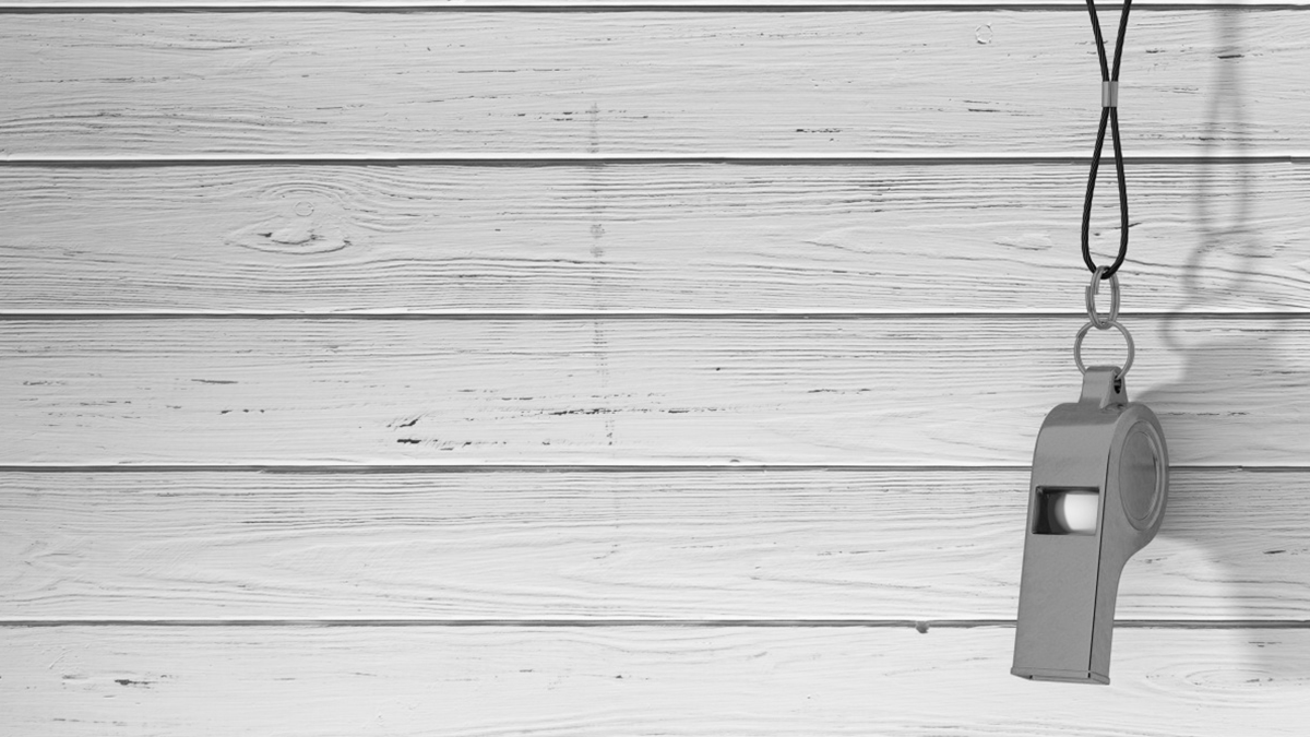 A whistle hanging on a wall