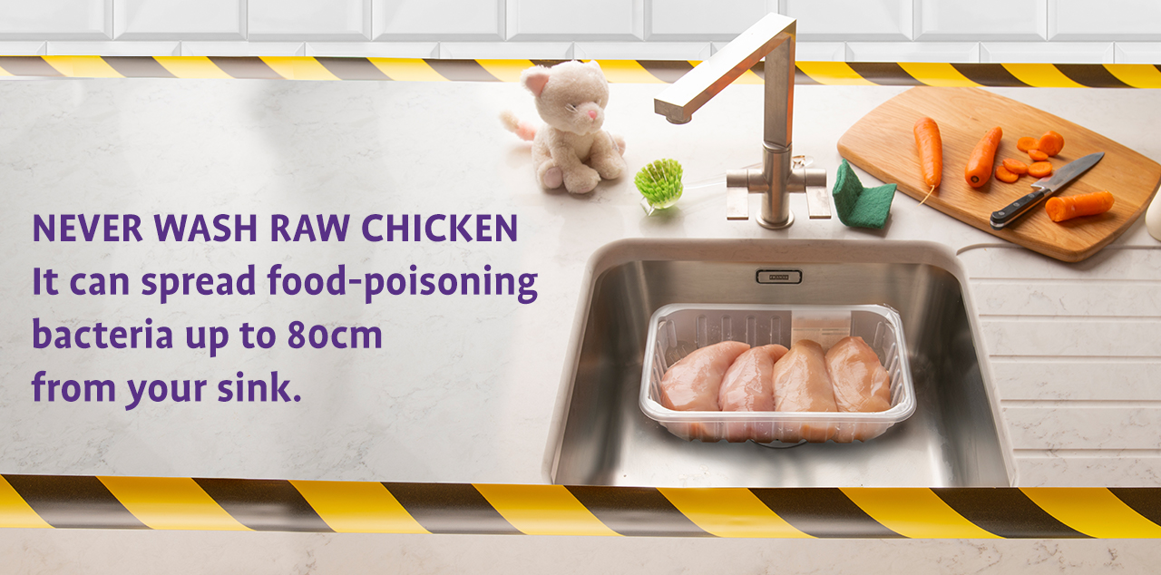 Chicken in a sink near child's toy on the counter