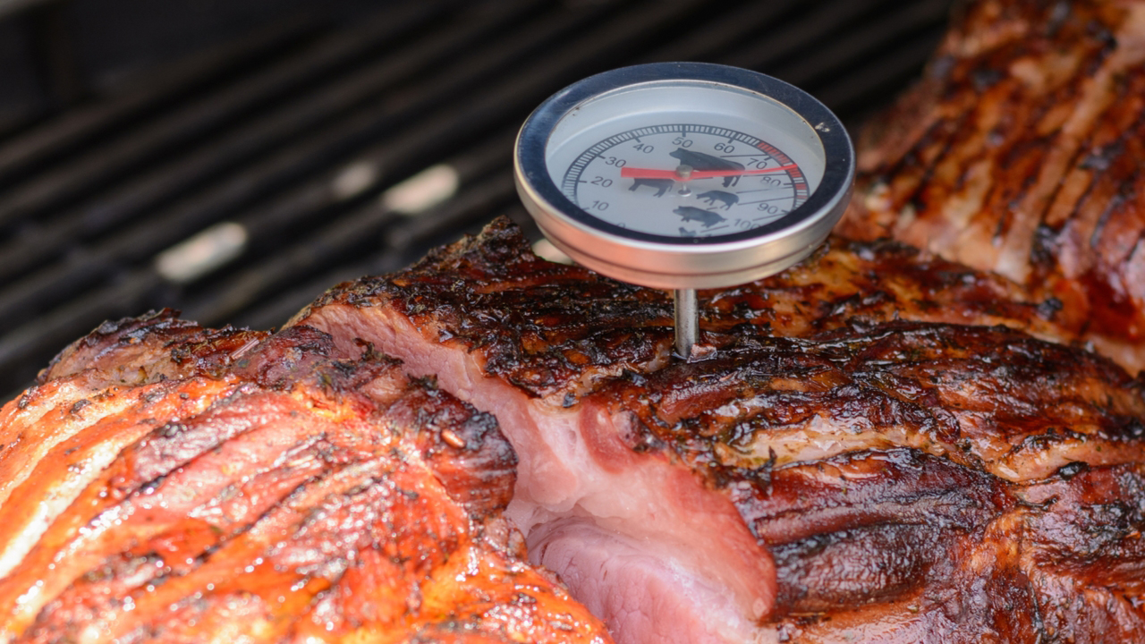 Meat thermometer in a pork joint