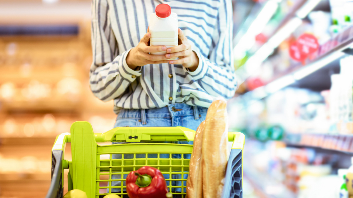 Shopper looking at milk label