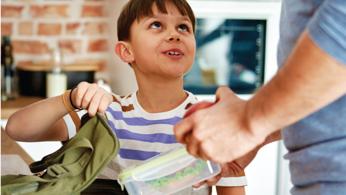 Dad and son preparing a lunchbox
