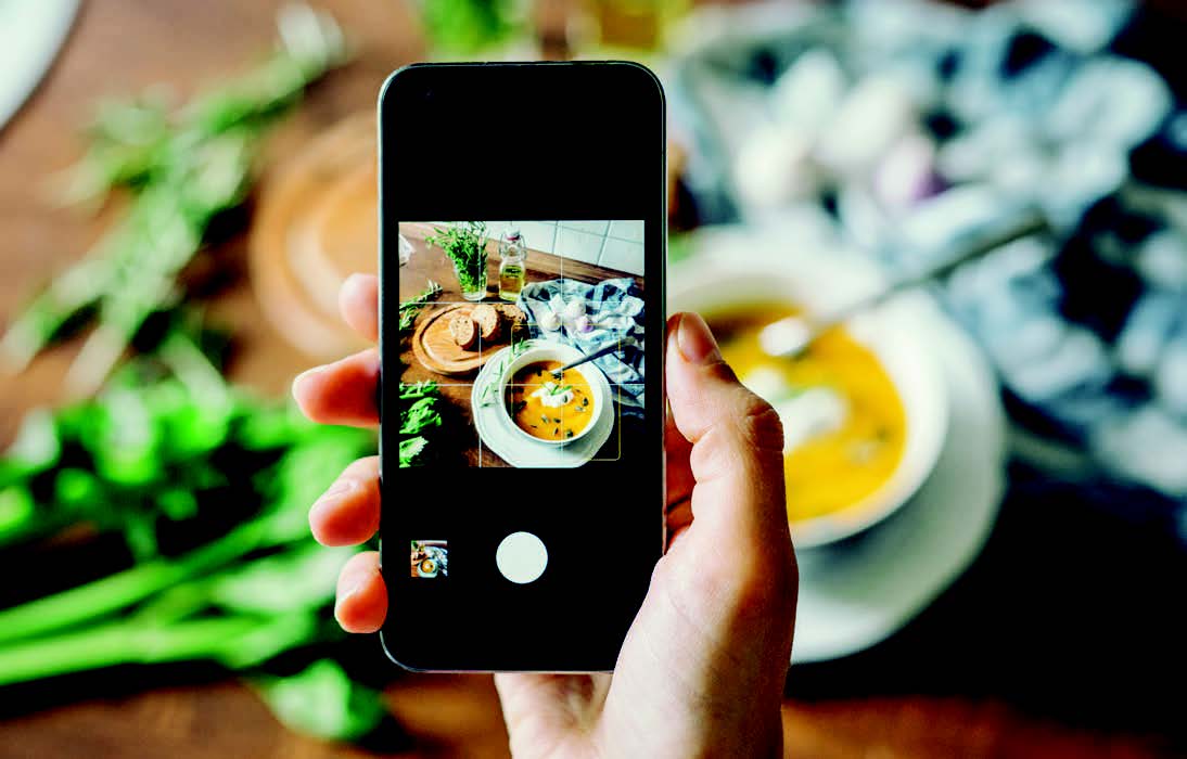A smartphone scanning a bowl of soup
