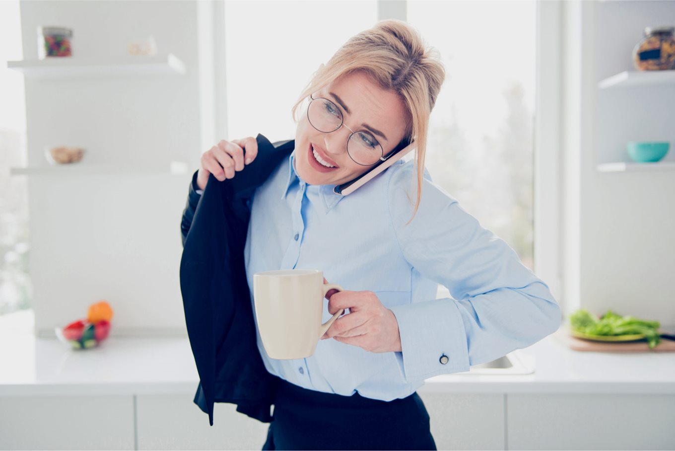 Woman grabs a coffee and gets ready for work