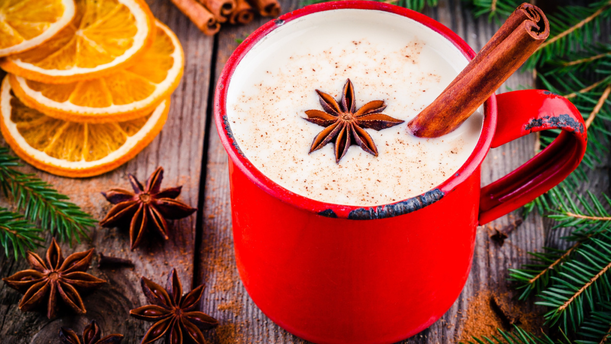 a mug of warm milk with star anise