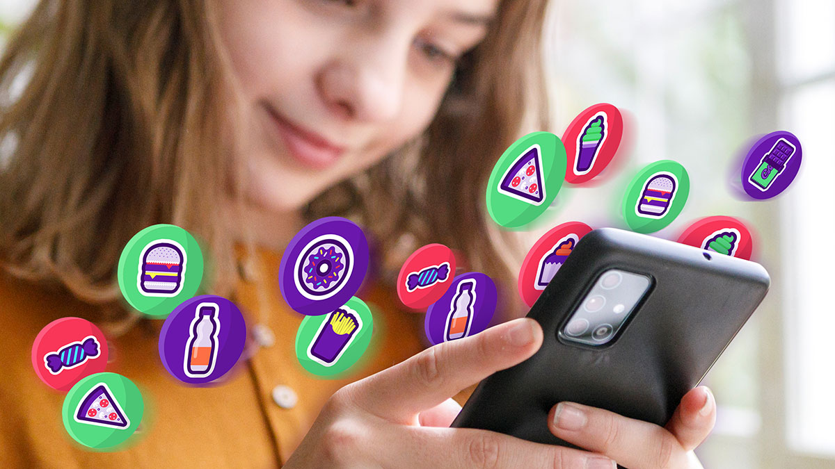 A young girl looking at her phone