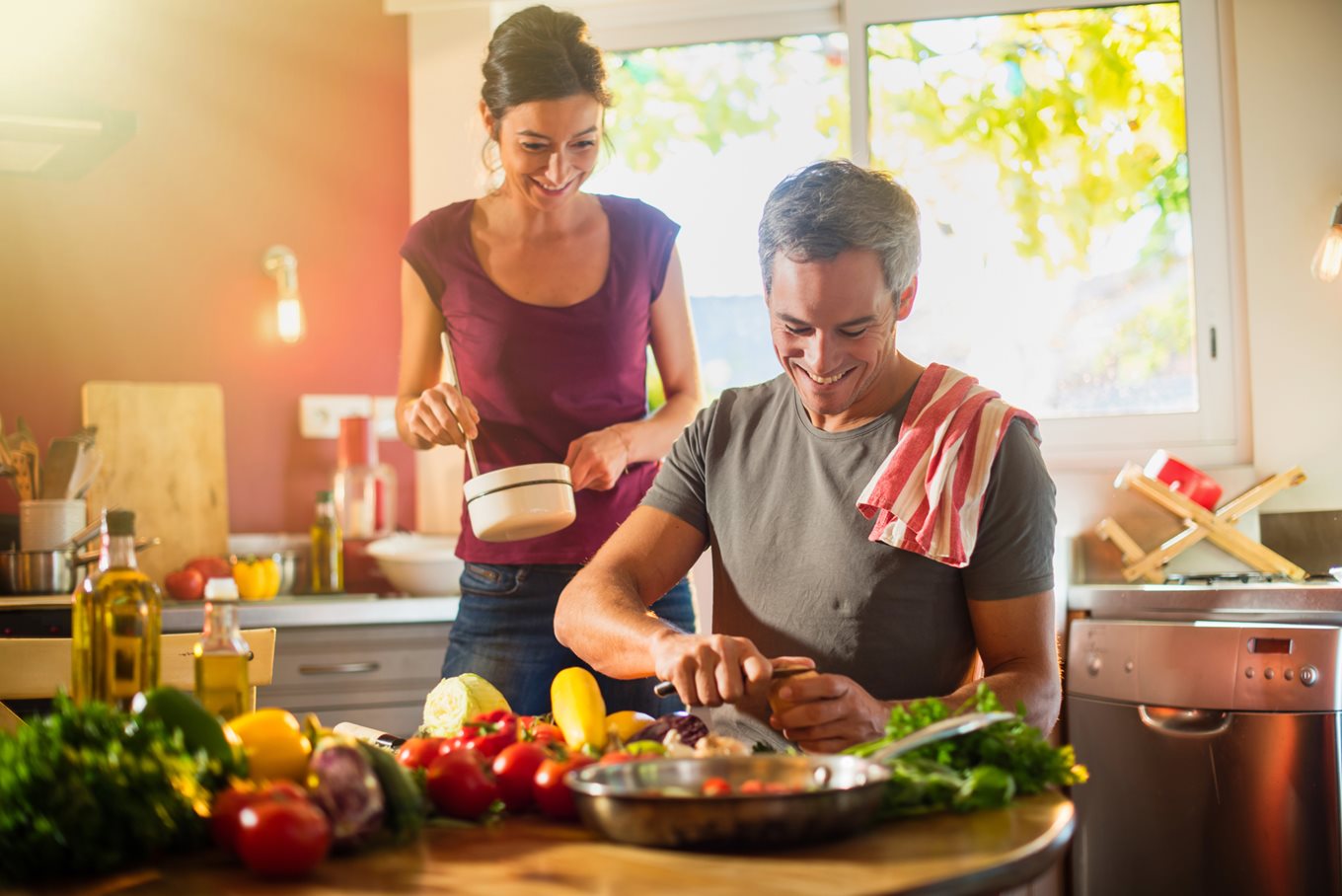 A healthy vegetarian couple prepare a meal