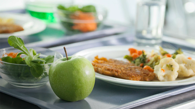 A healthy balanced meal in a care setting with meat, potatoes, fruit and veg