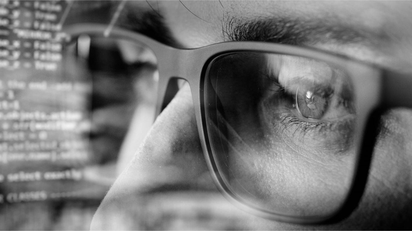 computer screen reflected in glasses