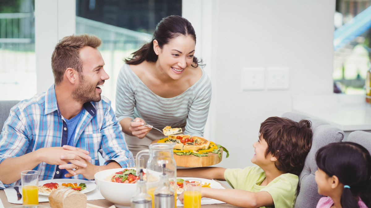 Happy family eating healthy salad